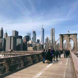 view of the New York City skyline from the Brooklyn Bridge